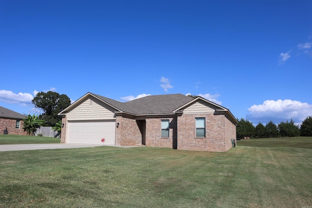 view of front facade featuring a front yard and a garage