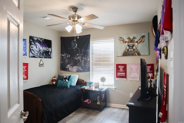 bedroom featuring ceiling fan and light wood-type flooring