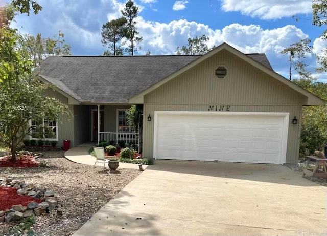 ranch-style house featuring a porch and a garage