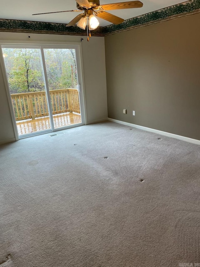 carpeted empty room with ceiling fan