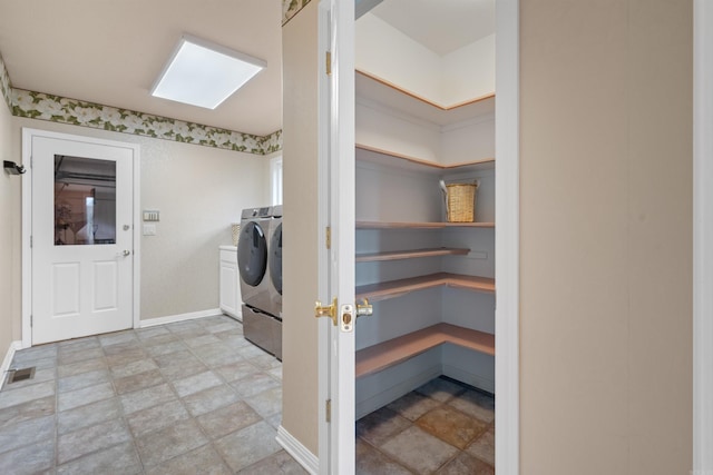 pantry featuring washer and clothes dryer