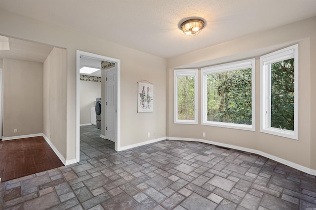 unfurnished room with washer / dryer