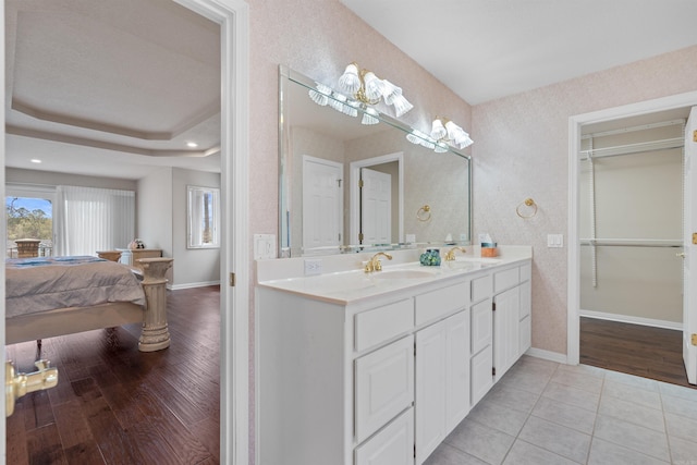 bathroom with vanity and hardwood / wood-style floors