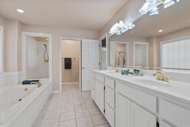 bathroom with shower with separate bathtub, tile patterned floors, and vanity