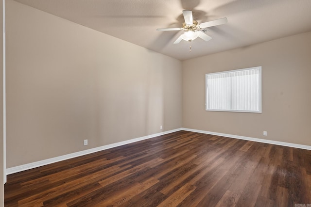 empty room featuring ceiling fan and dark hardwood / wood-style floors