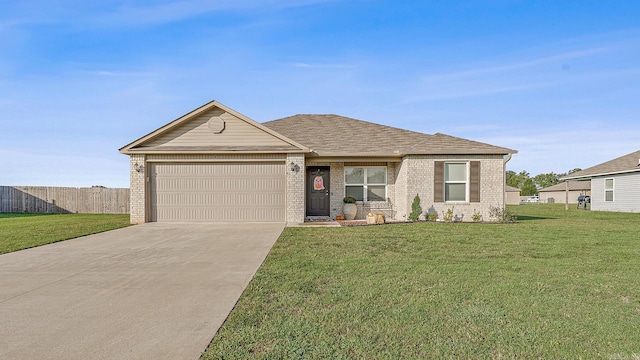 view of front of property featuring a front yard and a garage