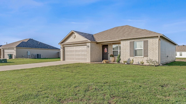 view of front of property with a garage, central AC, and a front yard