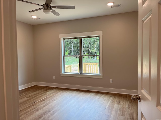 spare room with ceiling fan and light hardwood / wood-style flooring