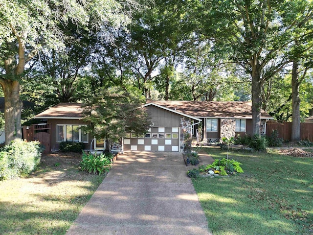 view of front facade with a front lawn and a garage