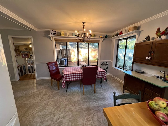 dining space featuring a notable chandelier and crown molding