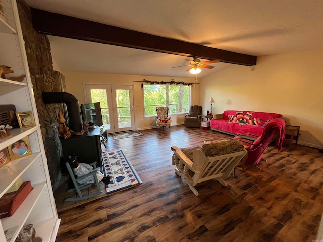 living room featuring beamed ceiling, dark hardwood / wood-style flooring, ceiling fan, and french doors