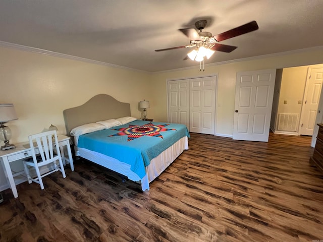 bedroom featuring ornamental molding, ceiling fan, and dark wood-type flooring