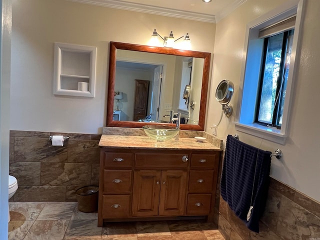 bathroom featuring crown molding, vanity, and toilet