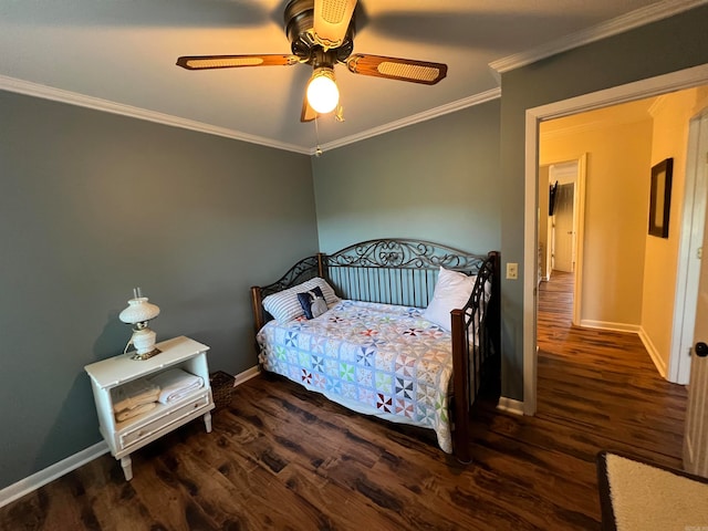 bedroom with ornamental molding, dark wood-type flooring, and ceiling fan