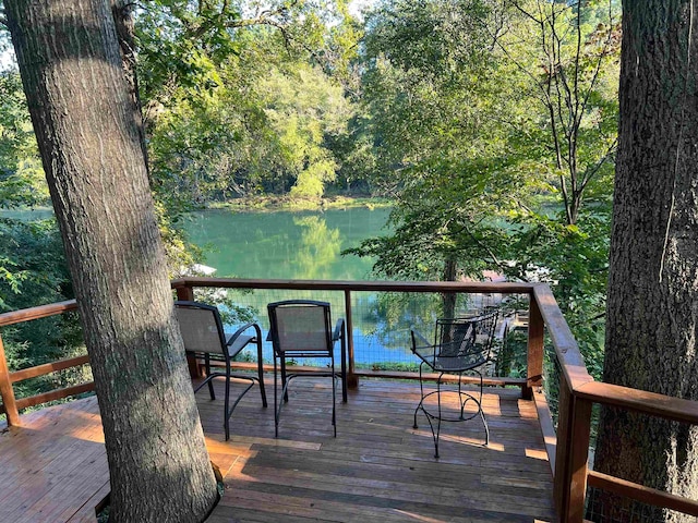 wooden deck featuring a water view