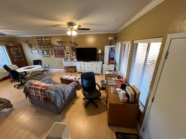 living room with ornamental molding, ceiling fan, and light hardwood / wood-style flooring