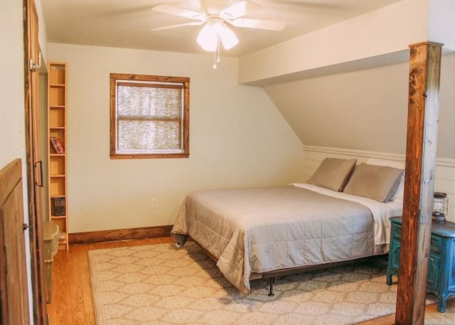 bedroom with ceiling fan and light hardwood / wood-style flooring