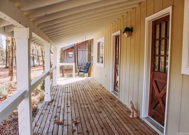 wooden terrace featuring a porch