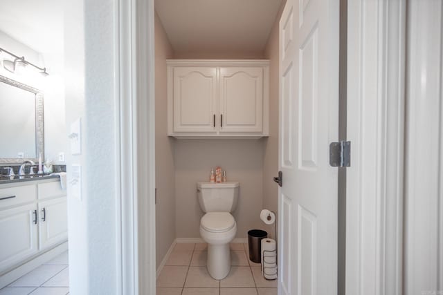 bathroom with tile patterned floors, vanity, and toilet