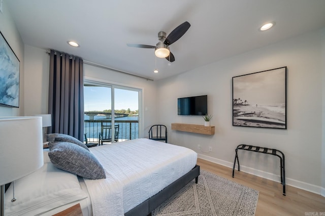 bedroom with ceiling fan, light wood-type flooring, and access to outside