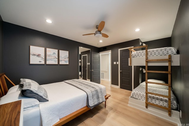 bedroom with light wood-type flooring and ceiling fan