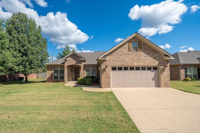 view of front of house with a garage and a front lawn