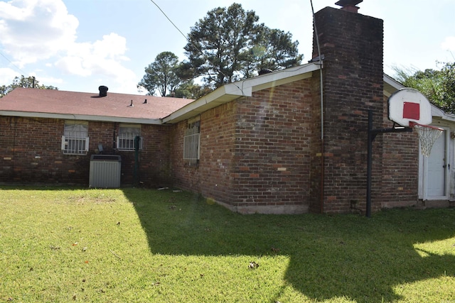 rear view of property with a yard