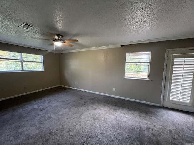 unfurnished room with a textured ceiling, a healthy amount of sunlight, and ceiling fan