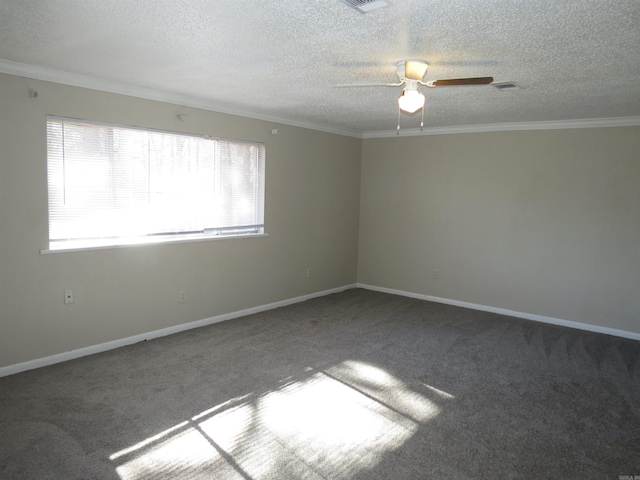 carpeted spare room featuring ceiling fan, a textured ceiling, and ornamental molding