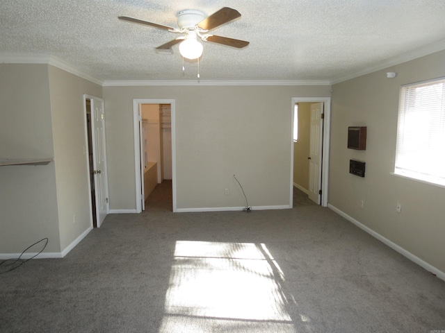 interior space featuring a spacious closet, connected bathroom, a closet, ceiling fan, and light carpet