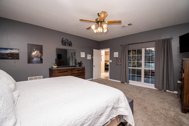 bedroom with ceiling fan and carpet flooring