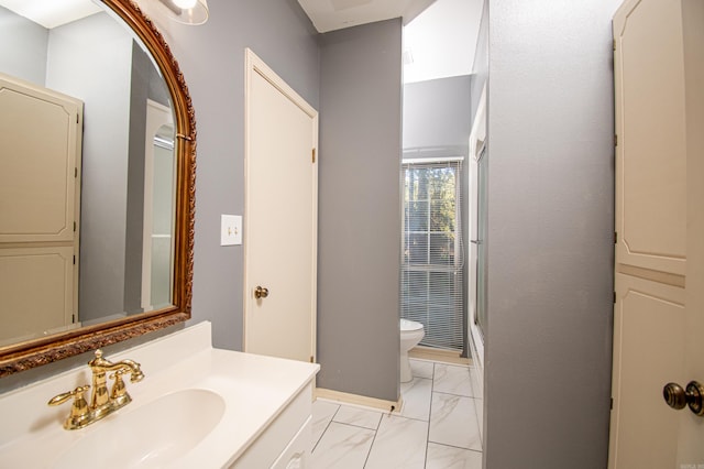 bathroom with a shower, vanity, and toilet