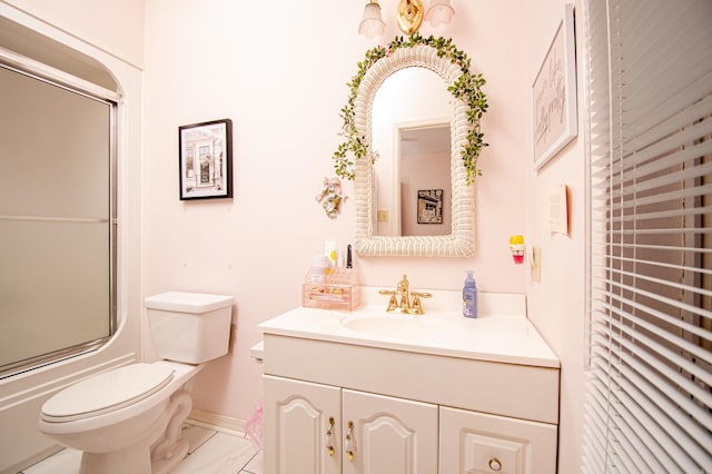 full bathroom with shower / bath combination with glass door, vanity, and toilet