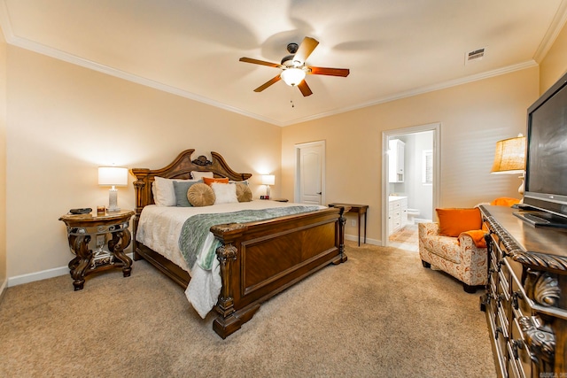 bedroom with ceiling fan, light colored carpet, ornamental molding, and ensuite bathroom