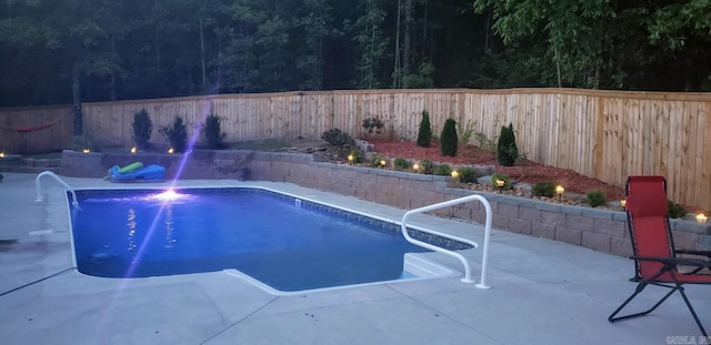 view of swimming pool featuring a patio and pool water feature