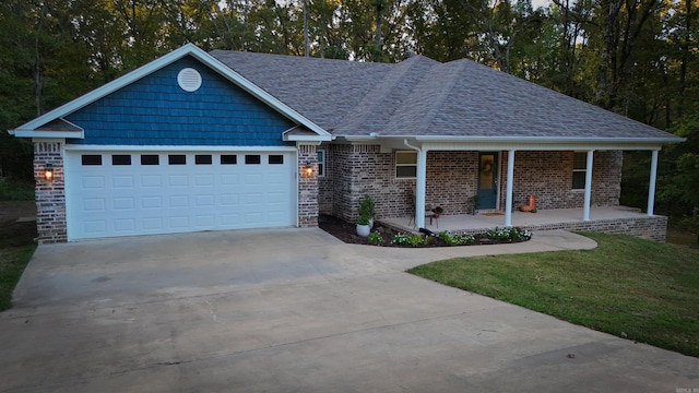 265 Pleasant Oaks Loop, El Paso, AR 72045 - single story home featuring a front lawn, concrete driveway, covered porch, brick siding, and a shingled roof
