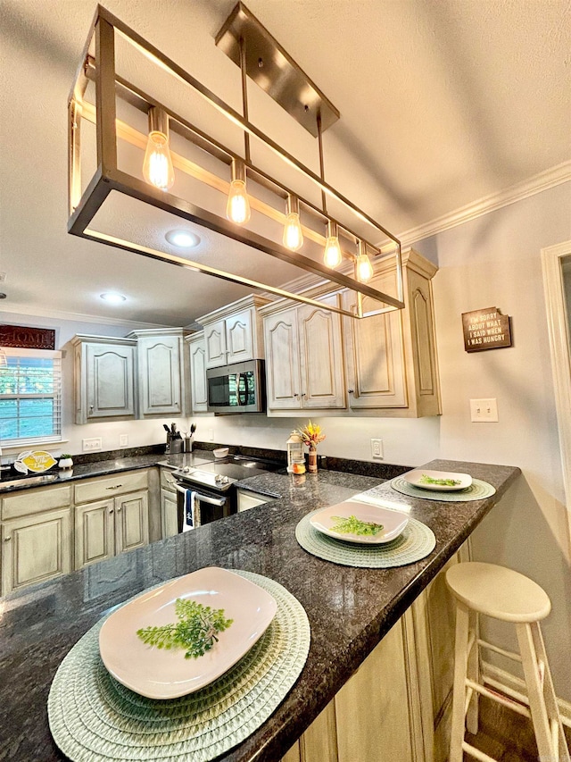 kitchen with pendant lighting, light brown cabinets, ornamental molding, stainless steel appliances, and dark stone counters