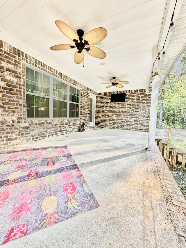 view of patio featuring ceiling fan