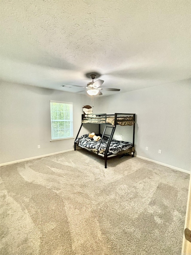 265 Pleasant Oaks Loop, El Paso, AR 72045 - bedroom featuring carpet floors, a textured ceiling, baseboards, and ceiling fan