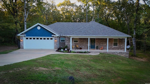 single story home featuring a front lawn, covered porch, and a garage