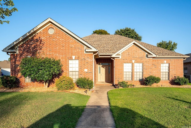 view of front of home featuring central AC unit and a front lawn