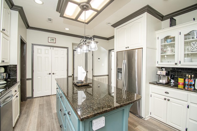 kitchen featuring visible vents, white cabinets, light wood-style floors, and appliances with stainless steel finishes