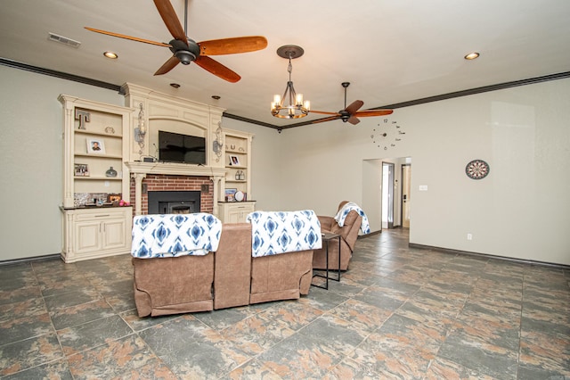 living area featuring ornamental molding, ceiling fan with notable chandelier, visible vents, a brick fireplace, and stone finish flooring