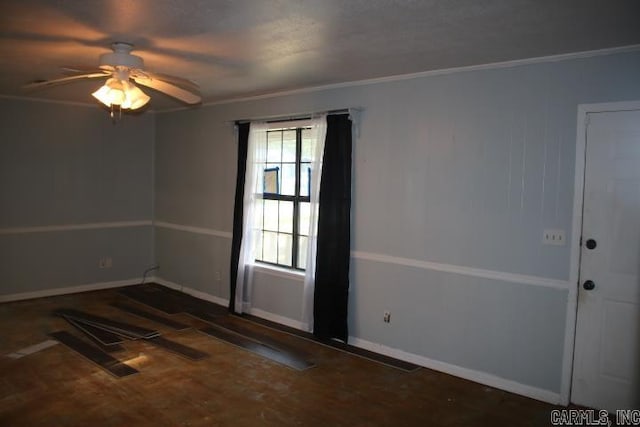 unfurnished room with ornamental molding and ceiling fan