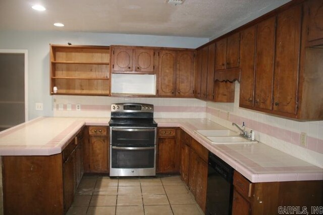 kitchen featuring black dishwasher, tasteful backsplash, sink, kitchen peninsula, and stainless steel electric stove