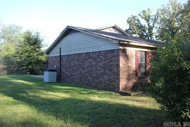 view of property exterior featuring a lawn and central air condition unit