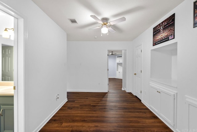 hall with dark hardwood / wood-style floors