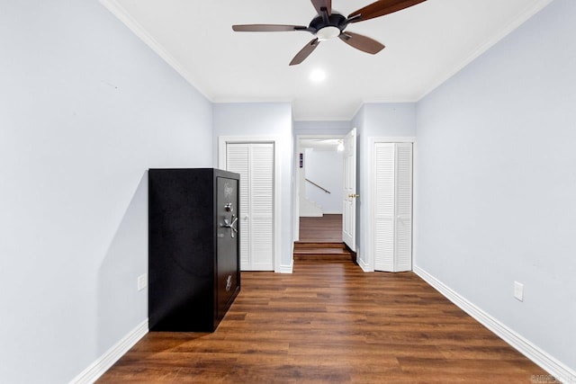 interior space with crown molding, dark hardwood / wood-style floors, and ceiling fan