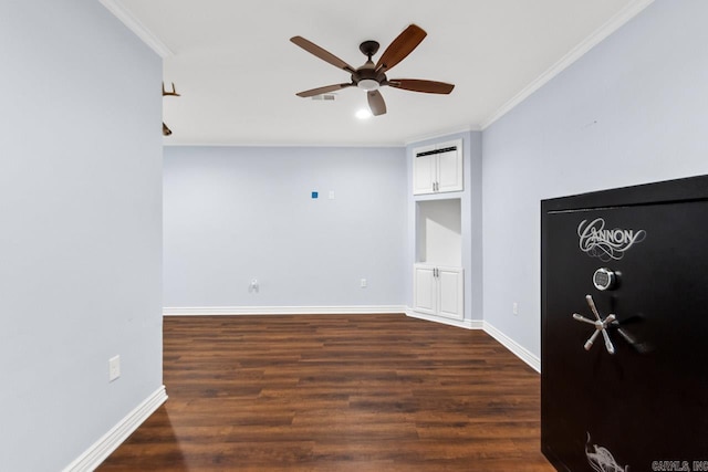 unfurnished room featuring crown molding, dark hardwood / wood-style flooring, and ceiling fan