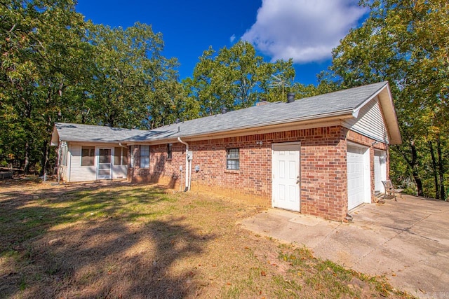 exterior space with a front lawn and a garage